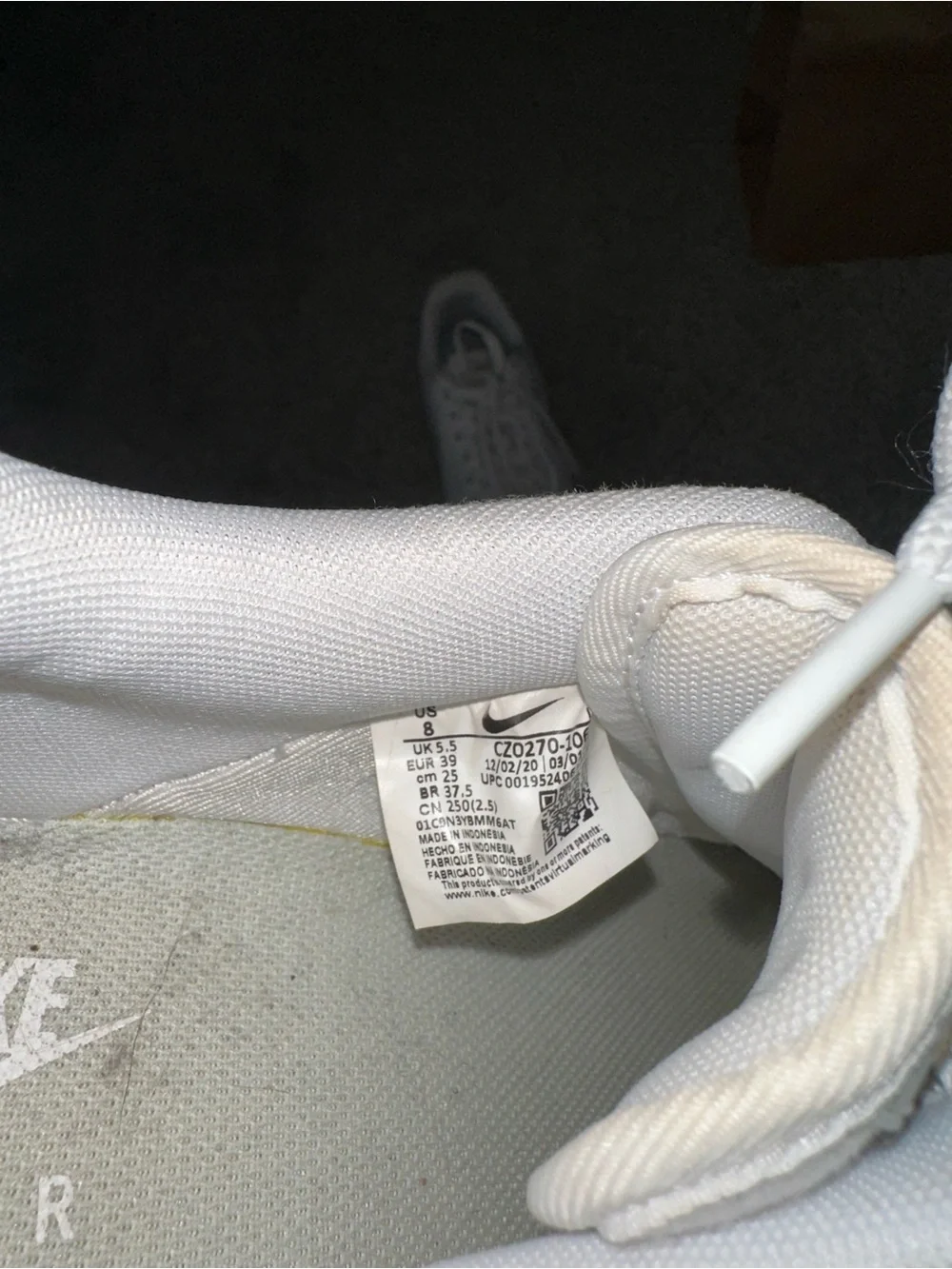 Nike White Sneakers with Sage Green Swoosh and Gold Accent